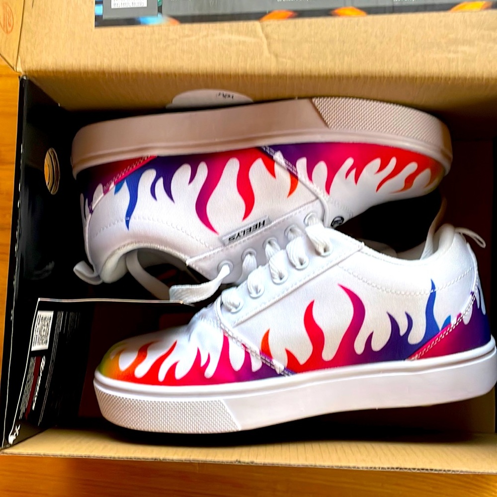 New condition Heelys, used for about 5 minutes total. Youth size 3.